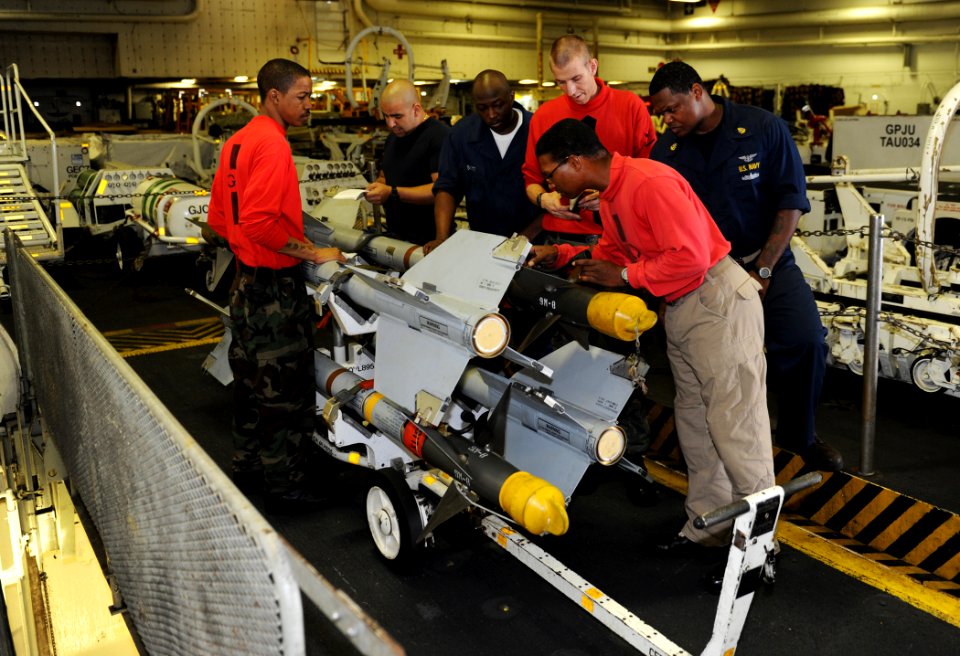 US Navy 100905-N-6362C-048 Lt. Cmdr. Raymond Parham inspects a set of newly received air intercept missiles