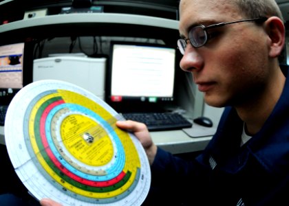 US Navy 100907-N-5538K-003 Aerographer's Mate Airman Adam M. Dallmann uses a psychometric computer to figure the day's high temperature
