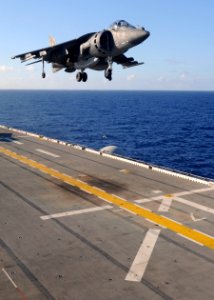 US Navy 100902-N-9950J-323 An AV-8B Harrier jet aircraft lands aboard the forward-deployed amphibious assault ship USS Essex (LHD 2) during the fly-on of the 31st Marine Expeditionary Unit (31st MEU) Aviation Combat Element photo