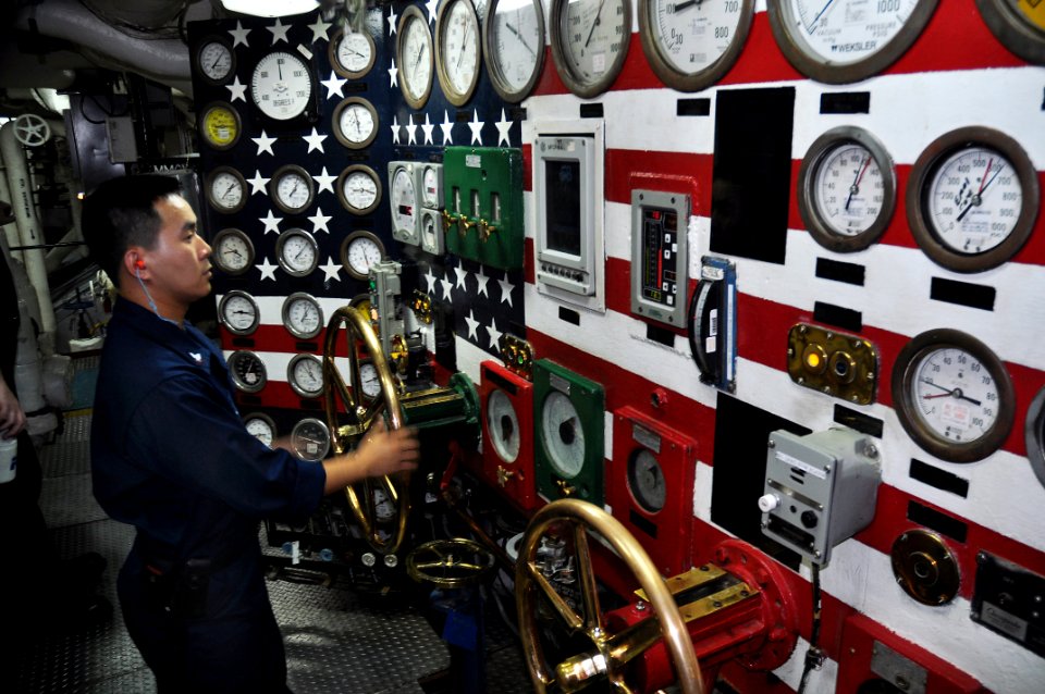 US Navy 100902-N-7293M-029 Machinist's Mate 3rd Class Sunny Qiu spins the