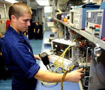 US Navy 100905-N-6362C-027 Aviation Electronics Technician Airman Apprentice Zachary Hoying checks the low altitude warning light on a radar altimeter indicator in the electrical instrument repair shop aboard USS Harry S. Truma