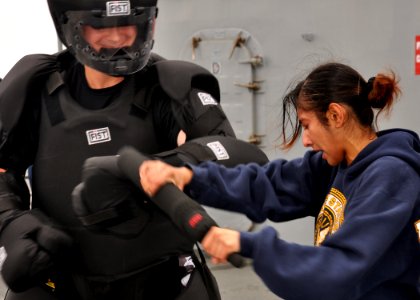 US Navy 100910-N-5483N-180 Hospital Corpsman 3rd Class Jyotiben Patel, right, fights Information Systems Technician 3rd Class Jared Chase after she