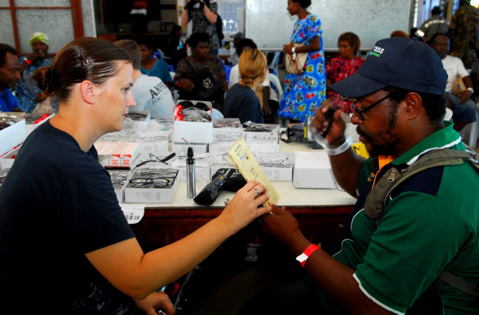 US Navy 100904-N-4044H-049 Hospital Corpsman 2nd Class Stephanie Stock, embarked aboard the Royal Australian Navy landing ship heavy HMAS Tobruk (L50), prepares to prescribe eyeglasses to a patient