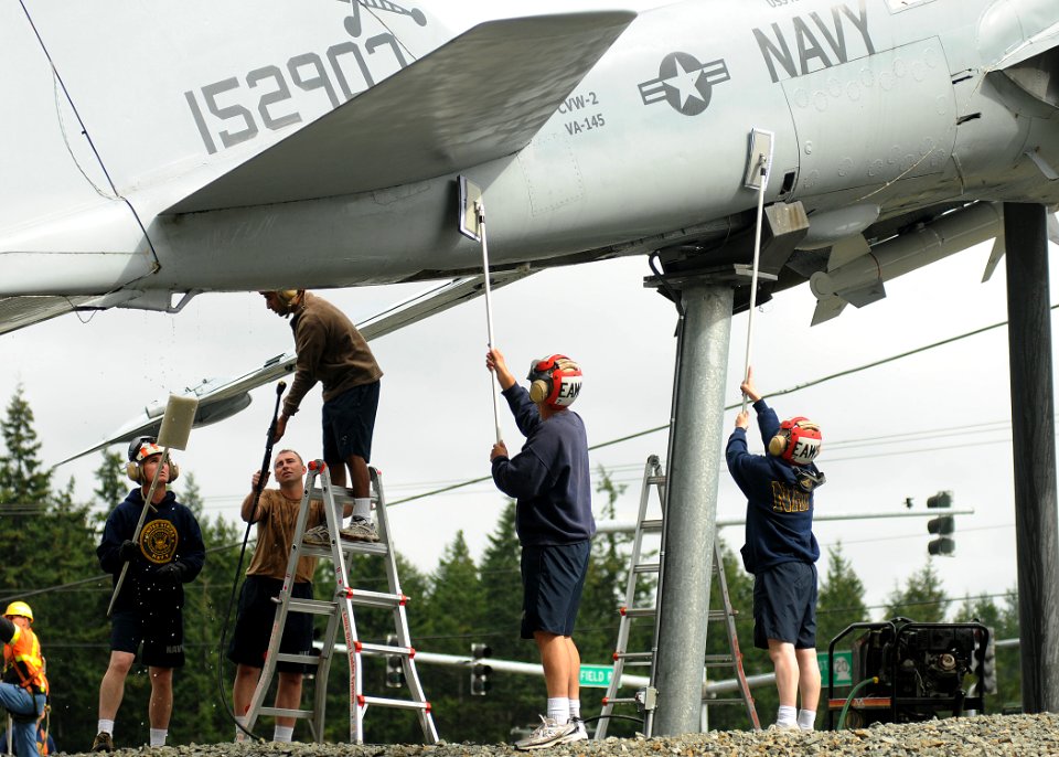 US Navy 100910-N-9520G-012 Chief petty officer selectees work together as they clean the display of the A-6 Intruder during the annual cleaning and