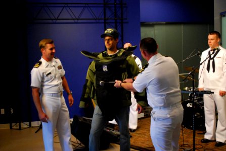 US Navy 100906-N-0869H-032 KTVI Fox-2 television personality Tim Ezell wears a bomb suit used by Explosive Ordnance Disposal Operational Support Unit Detachment 10
