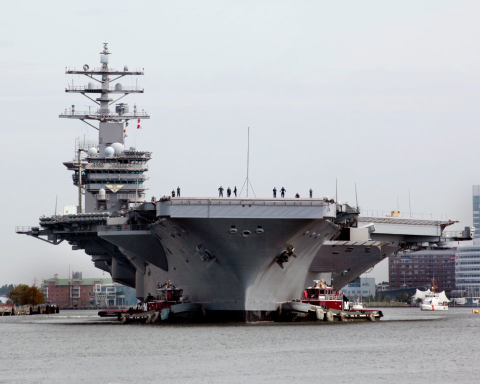 US Navy 100908-D-4748B-024 Tugboats guide the Nimitz-class aircraft carrier USS Dwight D. Eisenhower (CVN 69) on the Elizabeth River
