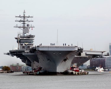 US Navy 100908-D-4748B-024 Tugboats guide the Nimitz-class aircraft carrier USS Dwight D. Eisenhower (CVN 69) on the Elizabeth River