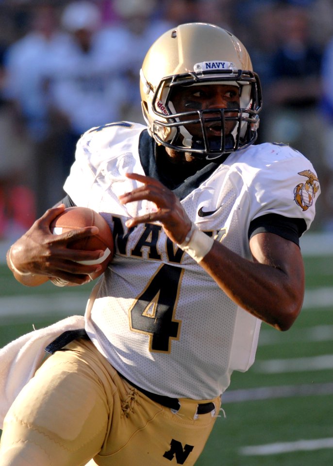 US Navy 100906-N-3857R-017 U.S. Naval Academy quarterback Ricky Dobbs attempts to break into open field during Navy's first varsity football game o