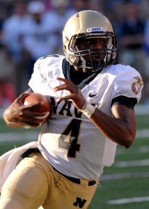 US Navy 100906-N-3857R-017 U.S. Naval Academy quarterback Ricky Dobbs attempts to break into open field during Navy's first varsity football game o