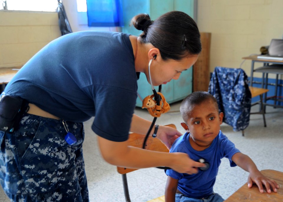 US Navy 100908-N-9964S-102 Lt. Amanda Higginson checks a child's heartbeat during clinic hours at the pediatric center in Guatemala