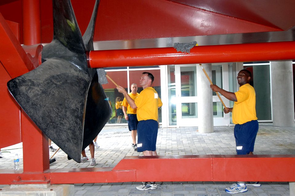 US Navy 100908-N-5292M-061 Sailors lean the propeller of the ironclad replica USS Monitor