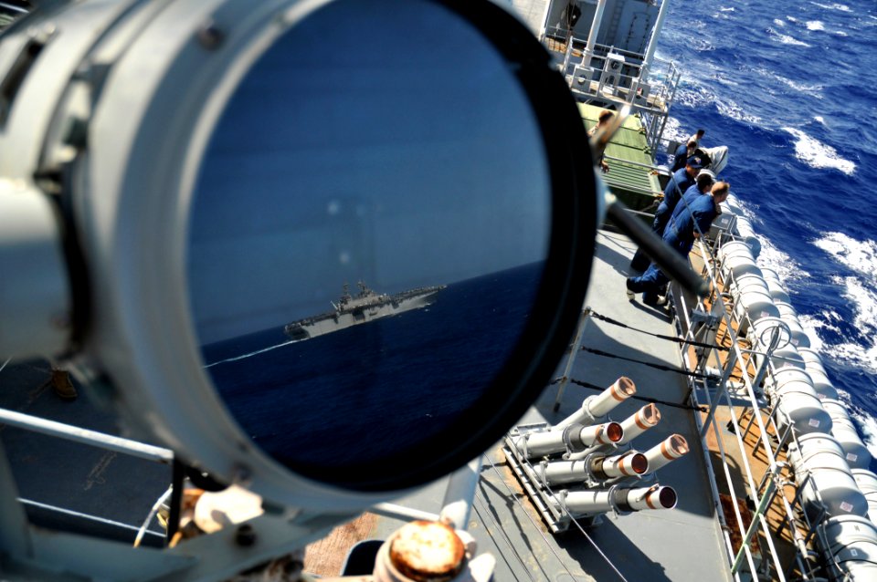US Navy 100907-N-7293M-059 USS Kearsarge (LHD 3) is reflected in a signal lamp aboard USS Ponce (LPD 15) during a leap frog navigation exercise