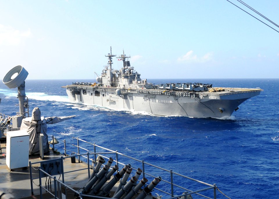 US Navy 100907-N-8069G-314 USS Kearsarge (LHD 3) cruises alongside USS Carter Hall (LSD 50) as it moves into position for a column maneuver exercis