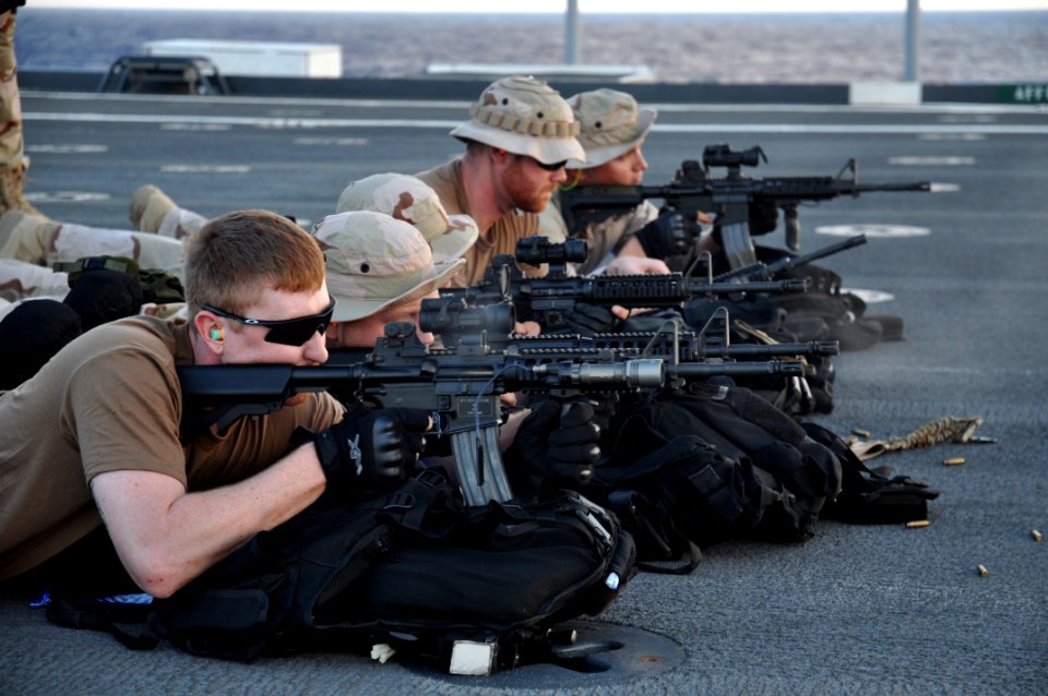 US Navy 100913-N-7293M-531 Sailors assigned to the visit, board, search, and seizure team aboard USS Ponce (LPD 15) practice live-fire drills on th