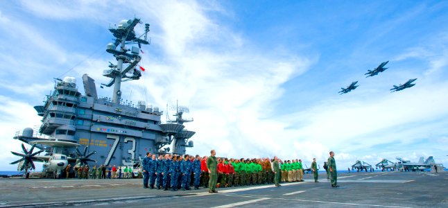 US Navy 100910-N-6720T-012 Sailors assigned to the Dambusters of Strike Fighter Squadron (VFA) 195 stand in formation on the flight deck of the air