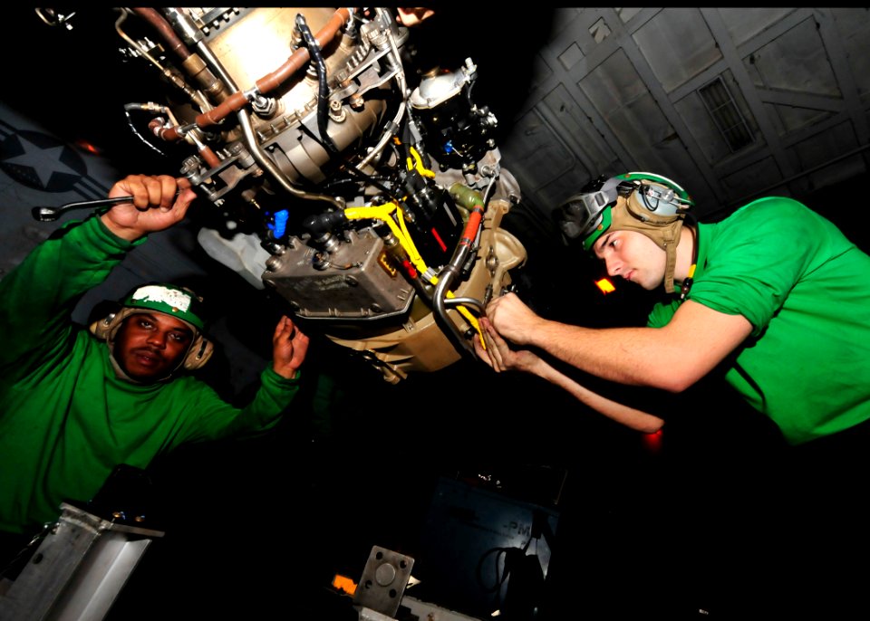US Navy 100908-N-0569K-015 Aviation Machinist's Mate 2nd Class Serge L. Leroy, left, and Aviation Machinist's Mate 2nd Class Thomas S. Upp prepare