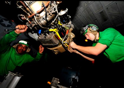 US Navy 100908-N-0569K-015 Aviation Machinist's Mate 2nd Class Serge L. Leroy, left, and Aviation Machinist's Mate 2nd Class Thomas S. Upp prepare
