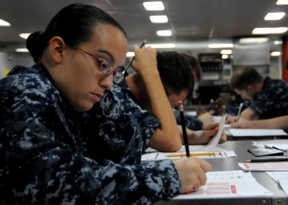 US Navy 100909-N-5215E-005 Aerographer's Mate 3rd Class Bonita Edwards takes the Navy-wide E-5 exam aboard the forward deployed amphibious assault
