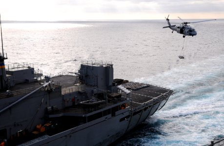 US Navy 100909-N-0232G-198 An MH-60S Sea Hawk helicopter lifts ordnance off the deck of the Military Sealift Command fast combat support ship USNS
