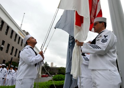 US Navy 100915-N-3215T-030 Chief petty officer selects raise the American and Japanese flags during morning colors at Commander, Fleet Activities Y photo
