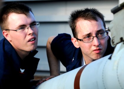 US Navy 100915-N-5538K-044 Fire Controlman 3rd Class Shane A Nichlos, left, and Fire Controlman 3rd Class Jonathan M. Jones load a RIM-7P Sea Sparr