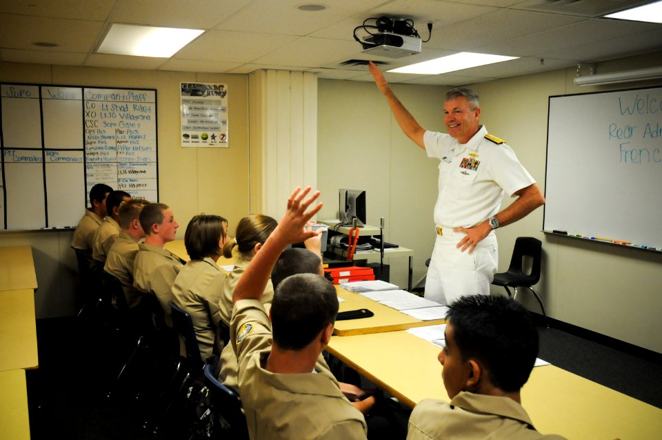 US Navy 100914-N-3271W-083 Rear Adm. William D. French, commander of Navy Region Southwest, speaks with Navy JROTC students at West High School