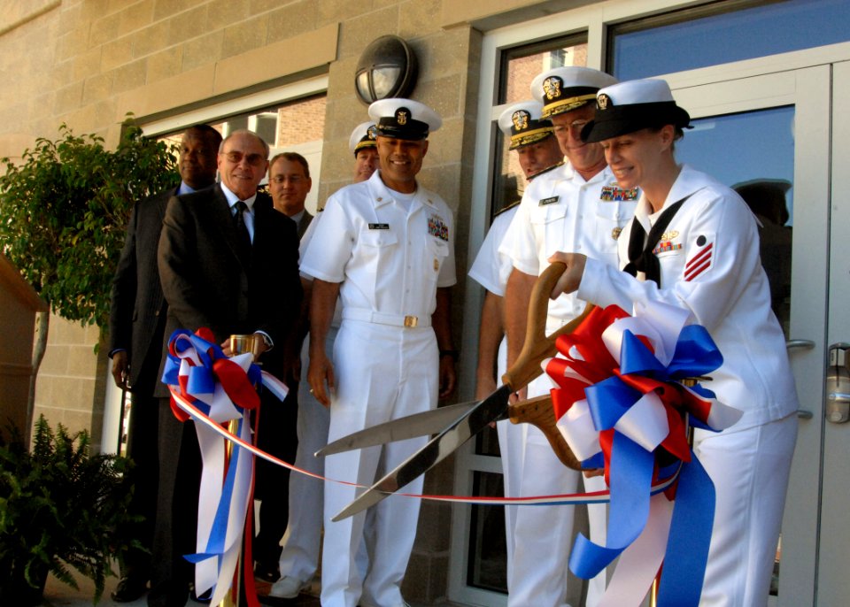 US Navy 100910-N-5700G-054 ireman Ashley Wood, assigned to the guided-missile destroyer USS McFaul (DDG 74), cuts the ribbon marking