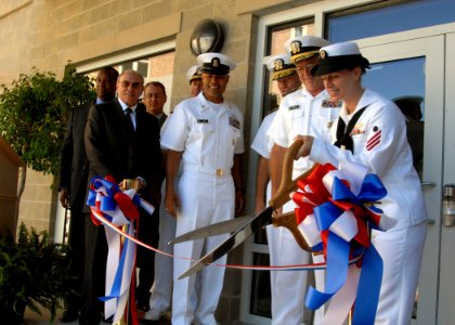 US Navy 100910-N-5700G-054 ireman Ashley Wood, assigned to the guided-missile destroyer USS McFaul (DDG 74), cuts the ribbon marking