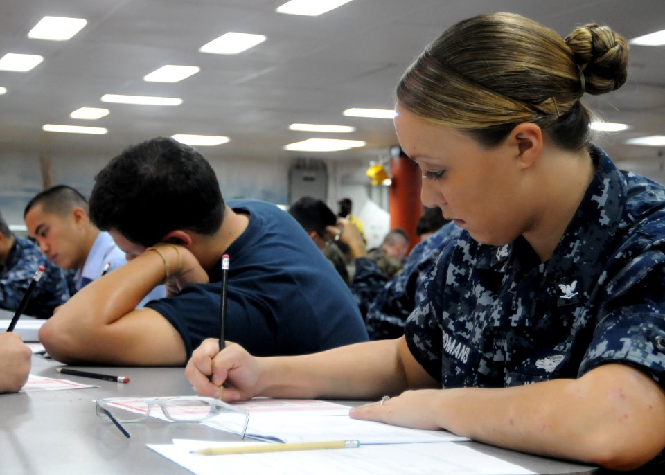 US Navy 100909-N-5215E-013 Master-at-Arms 3rd Class Crystal Romans takes the Navy-wide E-5 exam aboard the forward deployed amphibious assault ship