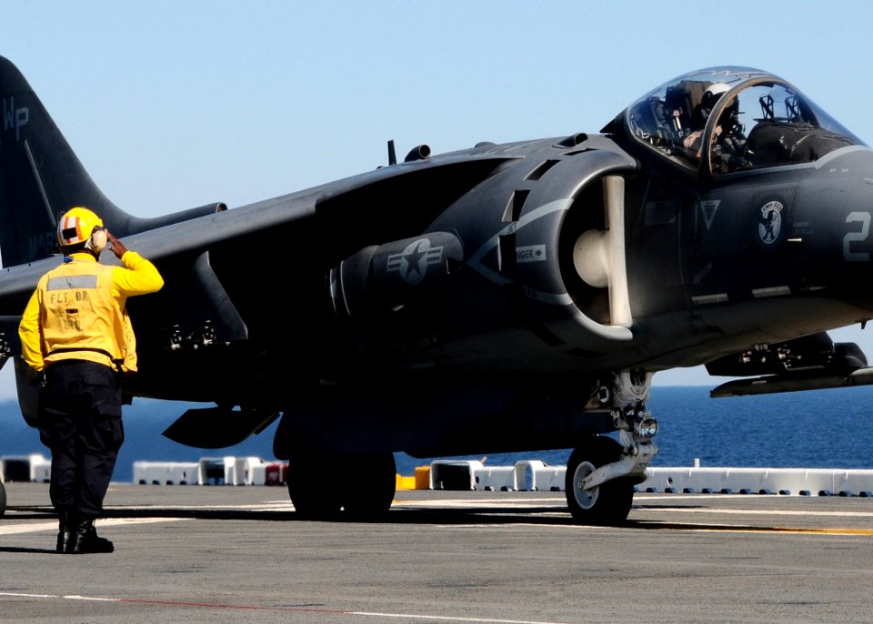 US Navy 100914-N-7508R-160 Sailor salutes pilot before launch