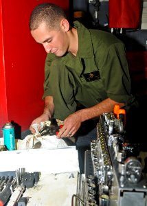 US Navy 100910-N-2908M-040 Lance Cpl. Mike Frear cleans tools to reduce corrosion aboard USS Kearsarge (LHD 3)