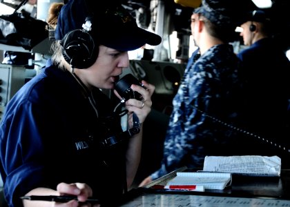 US Navy 100913-N-7508R-011 Boatswain's Mate Seaman Alycia Wilson relays messages through the sound-powered phone on the bridge of USS Bataan (LHD 5