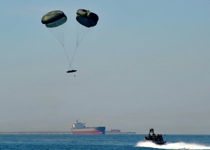 US Navy 100915-N-8689C-034 pecial warfare combatant-craft crewmen (SWCC) assigned to Special Boat Team (SBT) 20 pilot an 11-meter rigid-hull inflat