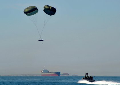 US Navy 100915-N-8689C-034 pecial warfare combatant-craft crewmen (SWCC) assigned to Special Boat Team (SBT) 20 pilot an 11-meter rigid-hull inflat photo