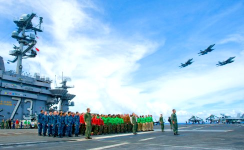 US Navy 100910-N-6720T-013 Sailors assigned to the Dambusters of Strike Fighter Squadron (VFA) 195 stand in formation on the flight deck of the air
