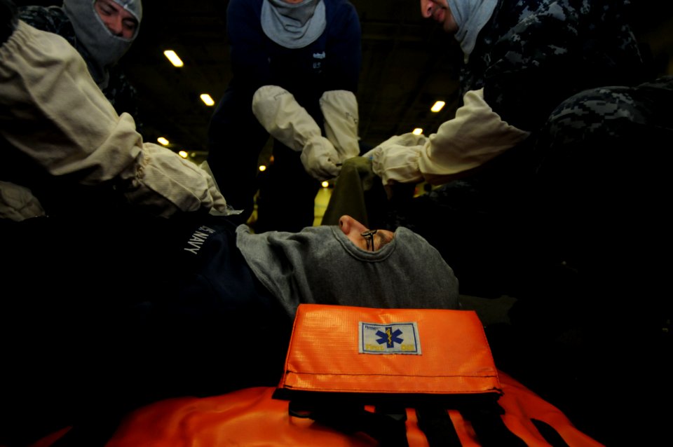 US Navy 100911-N-7605J-033 Logistics Specialist 3rd Class Carol Salgado is treated for a simulated chest wound during a general quarters drill a