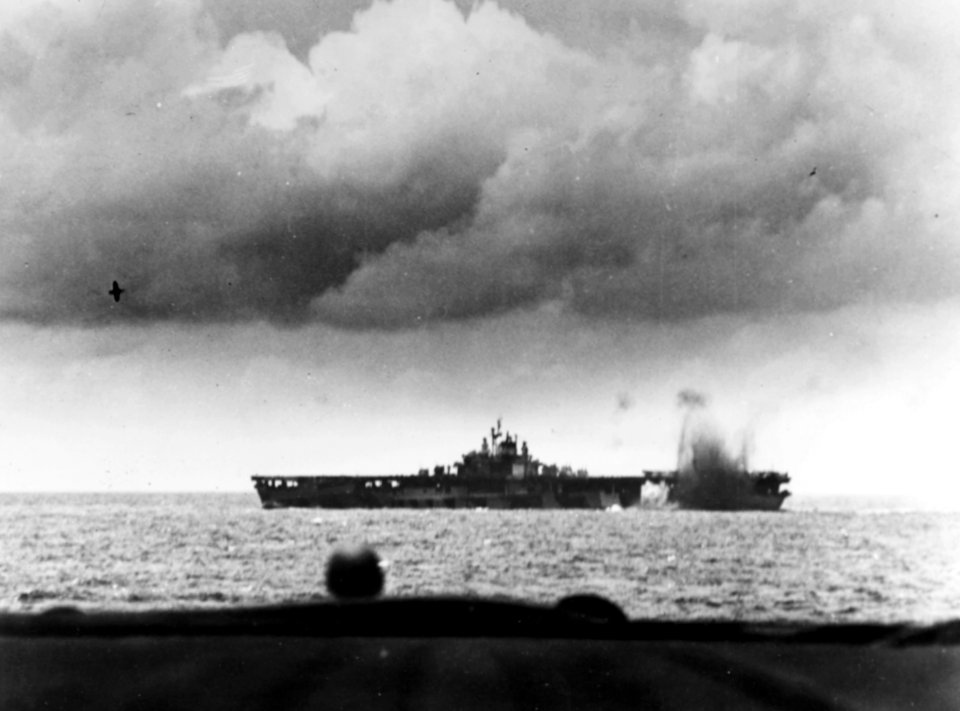 USS Bunker Hill (CV-17) is near-missed by a Japanese bomb during the Battle of the Philippine Sea, 19 June 1944 (80-G-366983)
