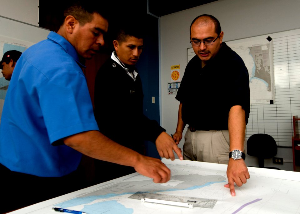 US Navy 100917-N-9095H-058 Chief Boatswain's Mate Jack Bustillos, right, mission commander of the security force assistance mobile training team