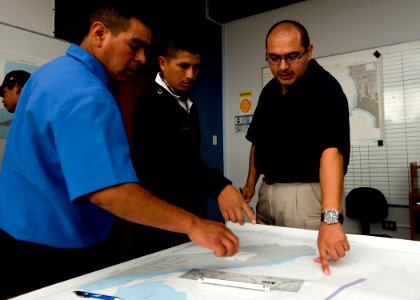 US Navy 100917-N-9095H-058 Chief Boatswain's Mate Jack Bustillos, right, mission commander of the security force assistance mobile training team