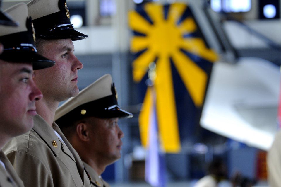 US Navy 100916-N-0775Y-017 Chief Mass Communication Specialist Joe Pfaff, center, assigned to Fleet Combat Camera Group Pacific