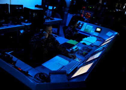 US Navy 100913-N-4973M-012 Lt. j.g. Craig Mueller, from St. Louis, Mo., and Lt. j.g. Zach Decker, from Boulder, Co., monitor the defense systems ab