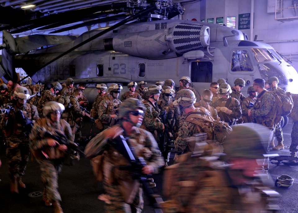 US Navy 100919-N-9950J-187 Marines assigned to the 31st Marine Expeditionary Unit (31st MEU) prepare for a simulated air raid aboard the forward-de