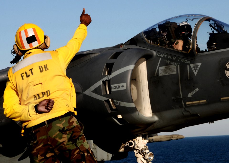 US Navy 100914-N-7508R-166 Sailor gives thumbs up to pilot