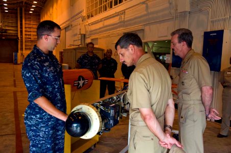 US Navy 100917-N-6433N-122 Aviation Electronics Technician 2nd Class Jonathan Morast briefs Vice Adm. Michael Vitale, center, commander of Naval In