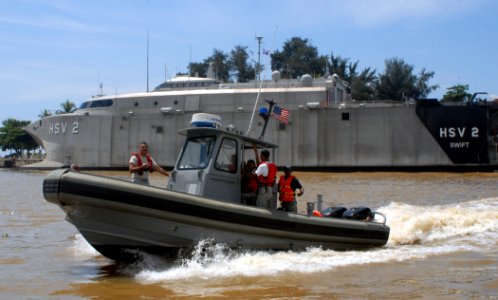 US Navy 100914-N-4971L-256 Sailors deployed aboard Swift (HSV 2) demonstrate proper techniques for maneuvering a rigid-hull inflatable (RHIB) boat