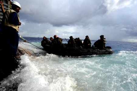 US Navy 100919-N-8335D-813 Marines assigned to the 31st Marine Expeditionary Unit (31st MEU) in a combat rubber reconnaissance craft approach the s