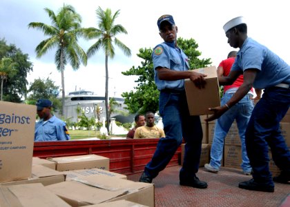 US Navy 100920-N-4971L-100 Members of the Dominican Republic defense forces load pallets of Project Handclasp humanitarian aid delivered by High Sp