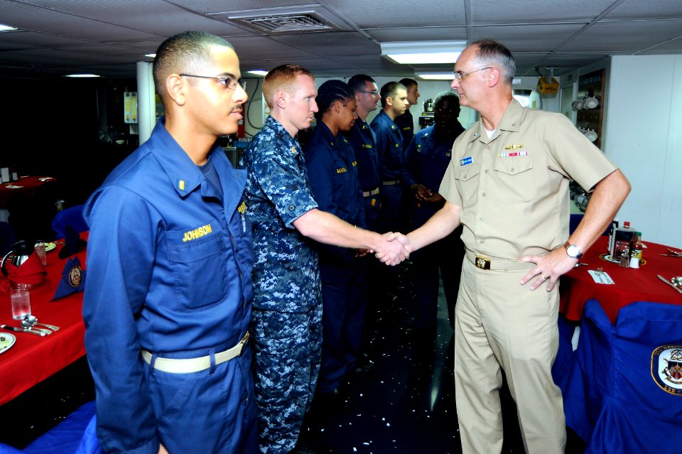 US Navy 100920-N-8335D-204 Rear Adm. Richard Landolt, commander of Amphibious Force, U.S. 7th Fleet, meets six newly reported Ensigns aboard the am