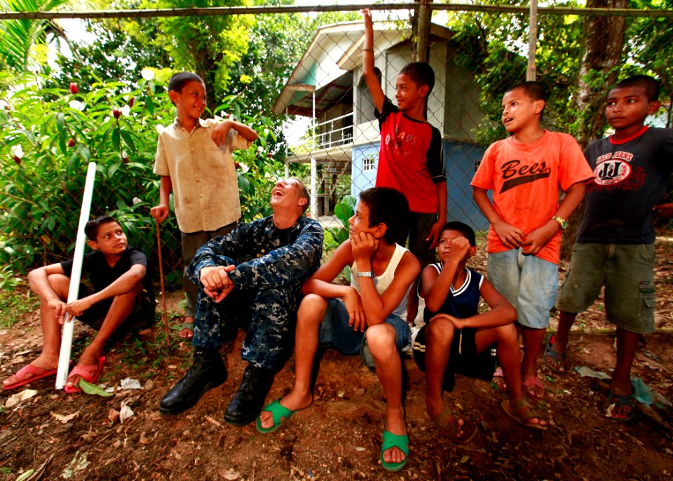 US Navy 100921-M-6740B-304 U.S. Navy Capt. Thomas M. Negus, commodore of Operation Continuing Promise 2010, visits with local Nicaraguan children a