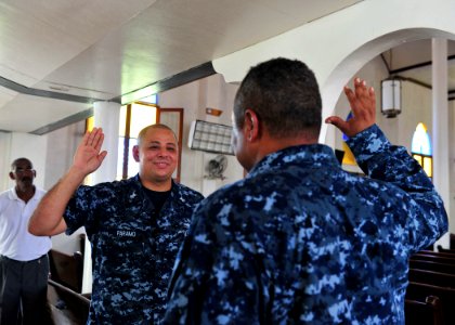 US Navy 100921-N-1531D-043 Chief Warrant Officer 4 Mike Rembert, right, from Chicago, assigned to the multipurpose amphibious assault ship USS Iwo